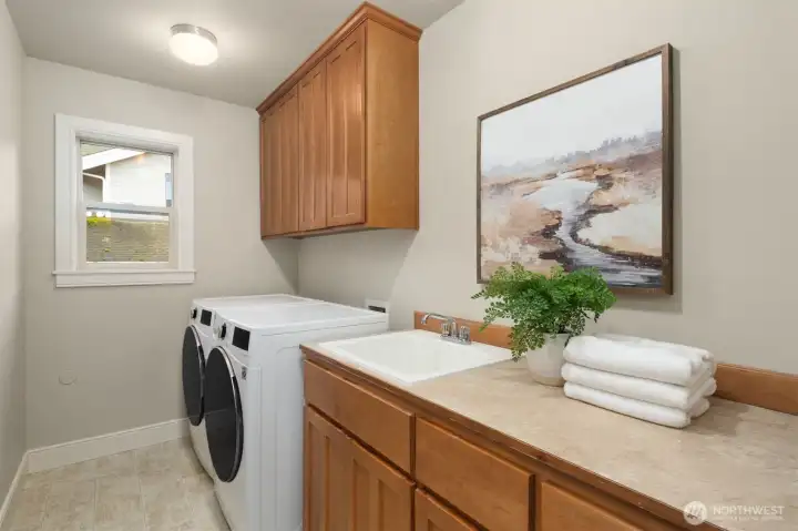Laundry room with utility sink conveniently located on the second level. Laundry room with utility sink conveniently located on the second level.