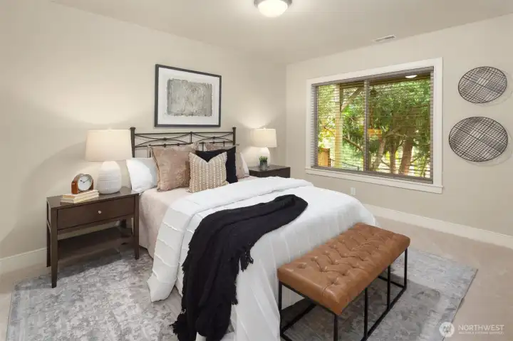 Bedroom #5 located in the lower level with an adjacent full bath. Perfect for a guest suite! Bedroom #5 located in the lower level with an adjacent full bath. Perfect for a guest suite!