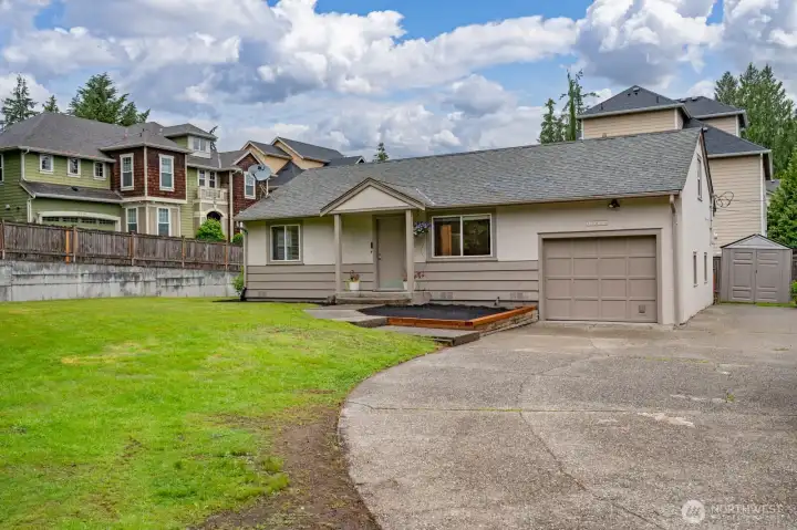 This efficient 2 Bedroom, 2 Bath home with an attached garage rests on a large oversized parcel; ready to enjoy, expand or develop.