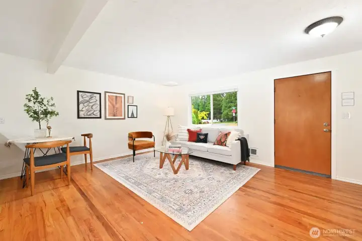 Main living area with hardwood flooring.