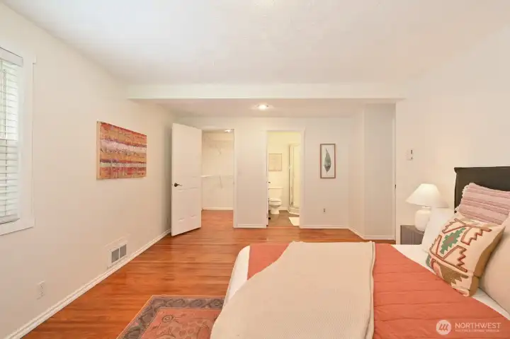 Primary suite with walk-in closet and 3/4 bath.