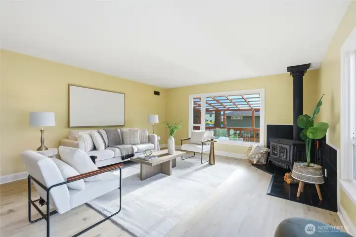 Bright living room with large windows and abundant natural light.
