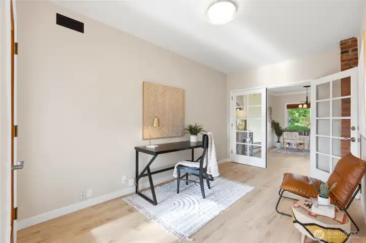 Flexible den or office space with French doors.