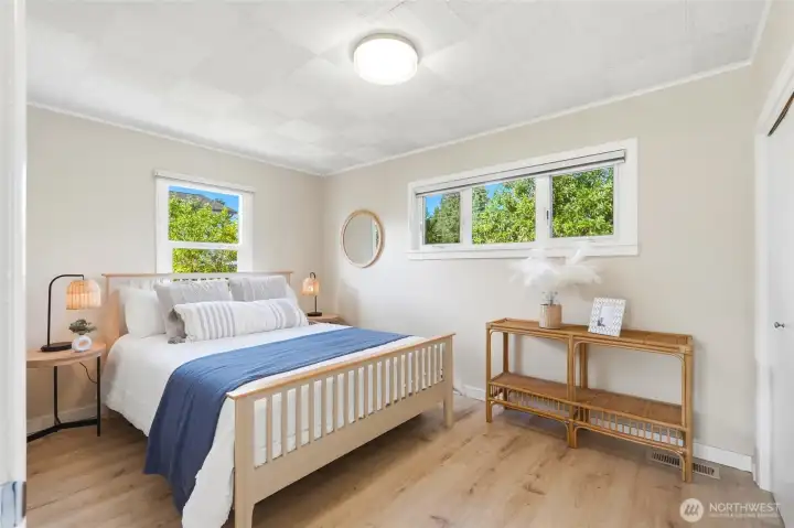 Main floor bedroom that enjoys much natural light.
