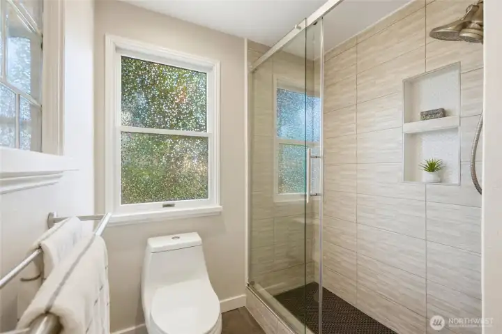 Main floor bathroom with updated walk-in tile shower.