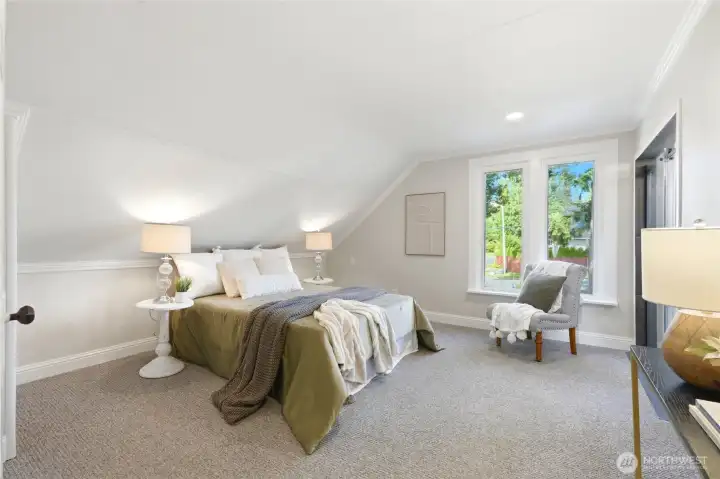 Upper-level primary bedroom with updated bathroom.