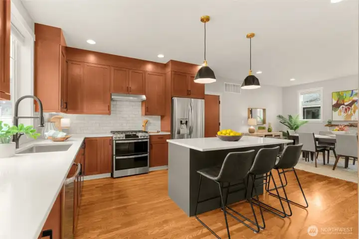 Gas range, stainless steel hood & refrigerator.