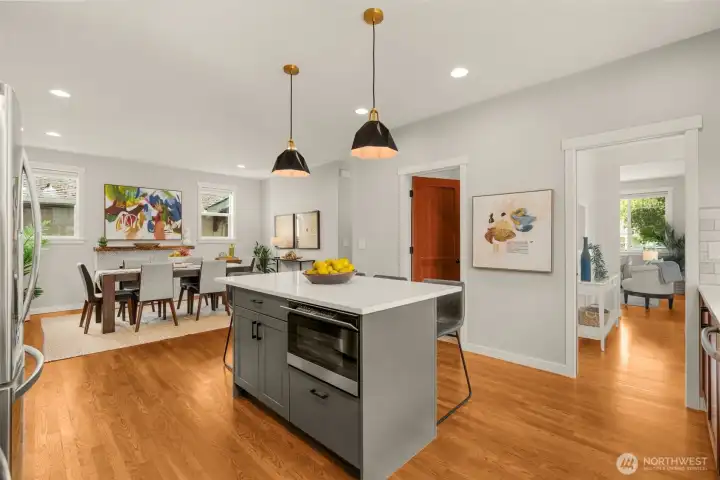 Island with quartz counter tops and built in microwave.