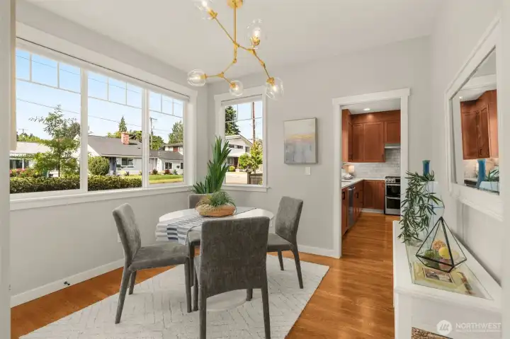 Designer light fixture highlights the dining space.