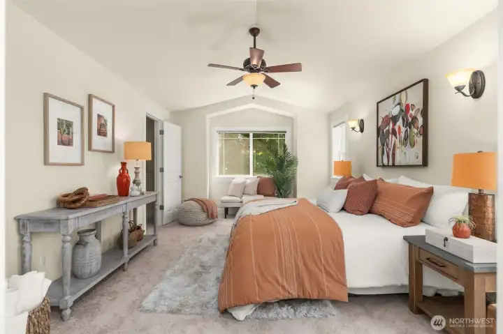 Spacious primary suite with new carpet & ceiling fan