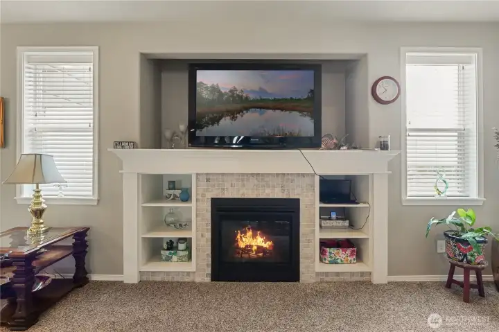 Tile-surround fireplace anchors the living room.