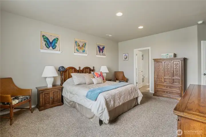Main-level primary suite offers everyday convenience.