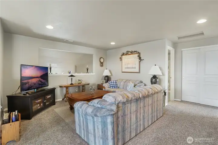 Versatile upstairs living area offers space to relax, entertain, or unwind.