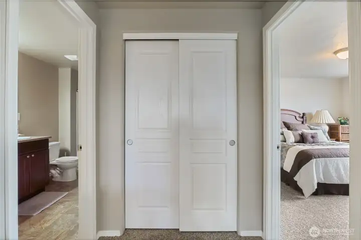 Wide upstairs hallway with additional storage and easy access to the upper-level bedrooms.