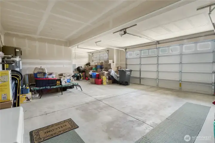 Spacious 3-car garage offers room for vehicles, golf carts, storage, and recreational equipment.