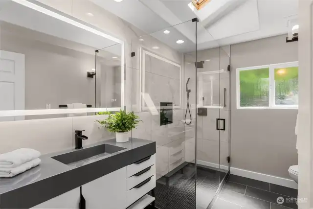 Spa like bathroom on the upper level! Heated floors, skylight, large glass shower…