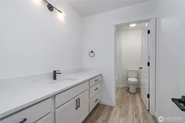 Upstairs Guest Bathroom - Pics are of a different 2834 plan. Features and colors may differ.