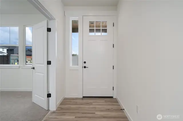 Main level entrance -Pics are of a different 2834 plan. Features and colors may differ.