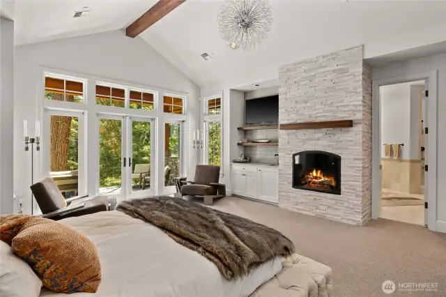 Primary Bedroom with fireplace and walk out to back patio