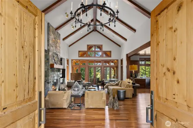 Luxurious entry through double doors into the home