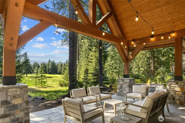 Back patio setting looking out at golf course and distant ridge views