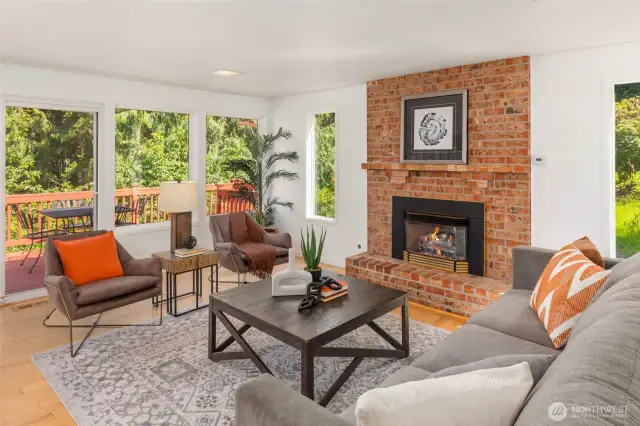 Gas fireplace in family room and large windows offer great natural light and territorial views