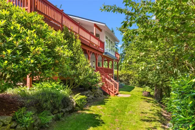 Lush backyard with abundance of Cherry Blossoms, Rhodies, & Lilacs