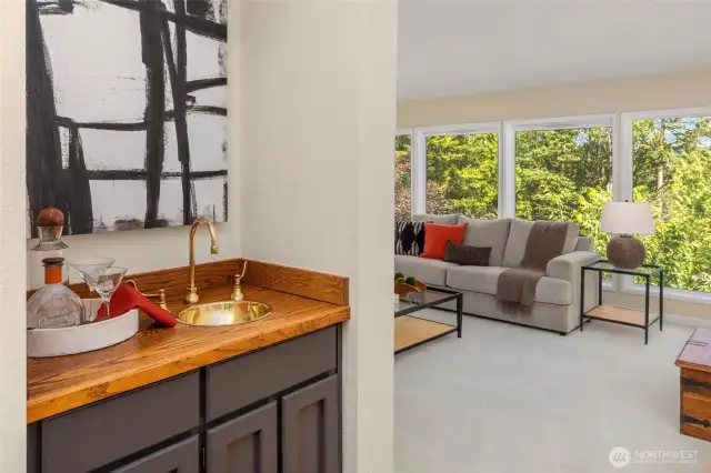 Wet bar between formal dining and living room