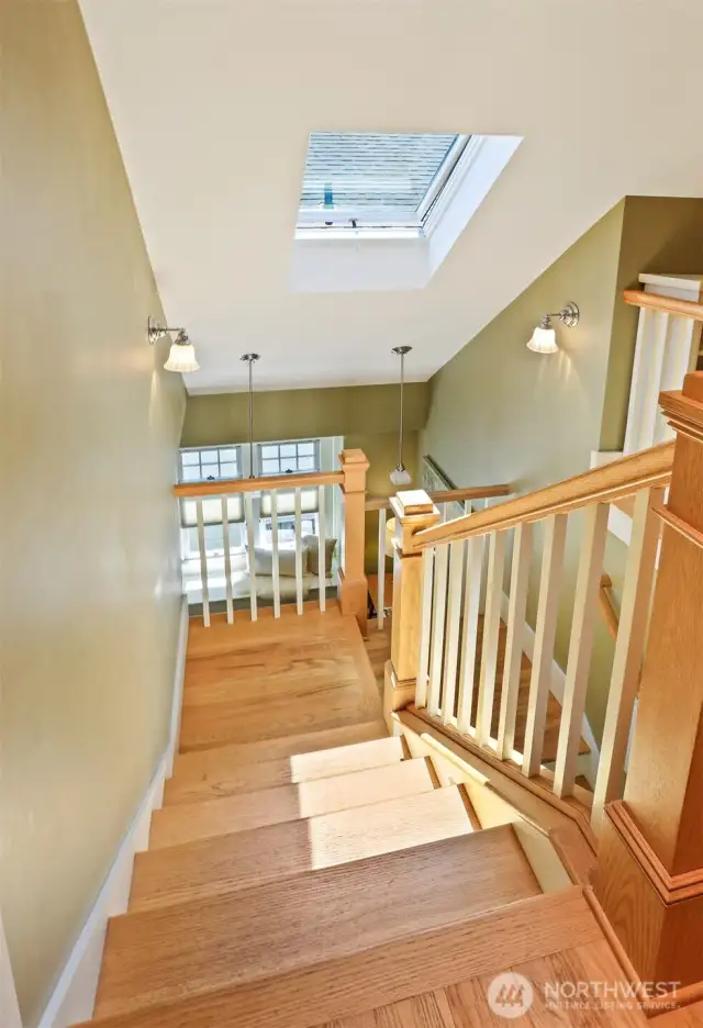 Craftsman style open staircase flooded with natural light.