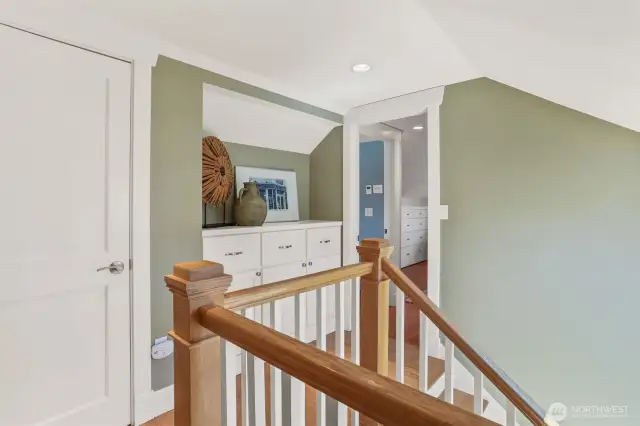 The top floor landing offers extra closet space and thoughtfully designed built-ins for optimal organization