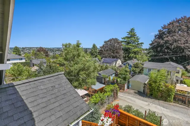 Good morning, sunshine! Enjoy peaceful, treetop views from the private primary suite balcony—and on a clear day, take in the stunning Cascade Mountain Range.