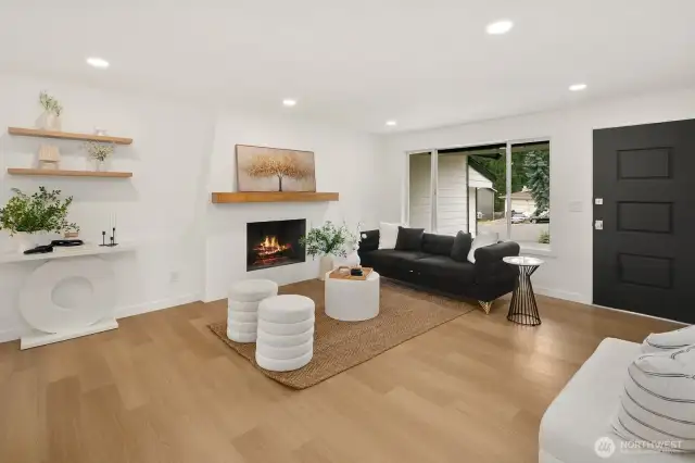 Woodburning fireplace and large windows.