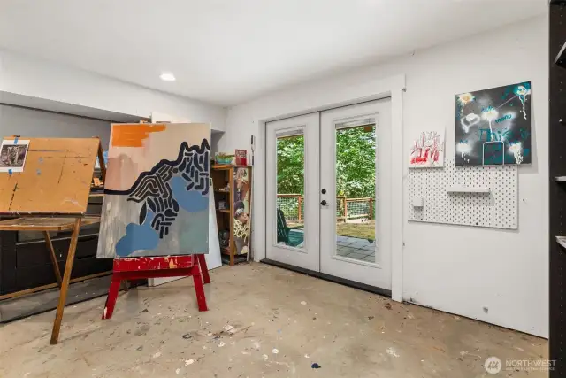 Golf cart garage adjacent to basement playroom w/ access to back yard.