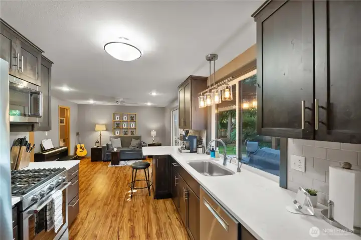 Kitchen updates make this a cooks dream. Dual fuel range, insta hot water at the tap and a spot to sit and eat or talk with the cook.