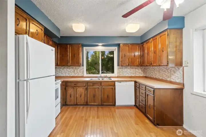 Kitchen with Hard wood floors and views of Dyes Inlet