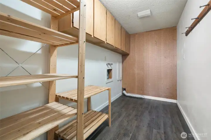 Nice size laundry room with built-in storage.