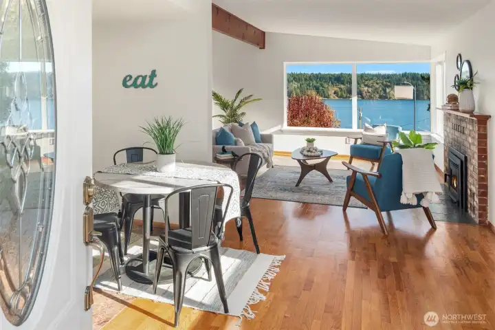 Original hardwood floors greet you but the view draws you in.