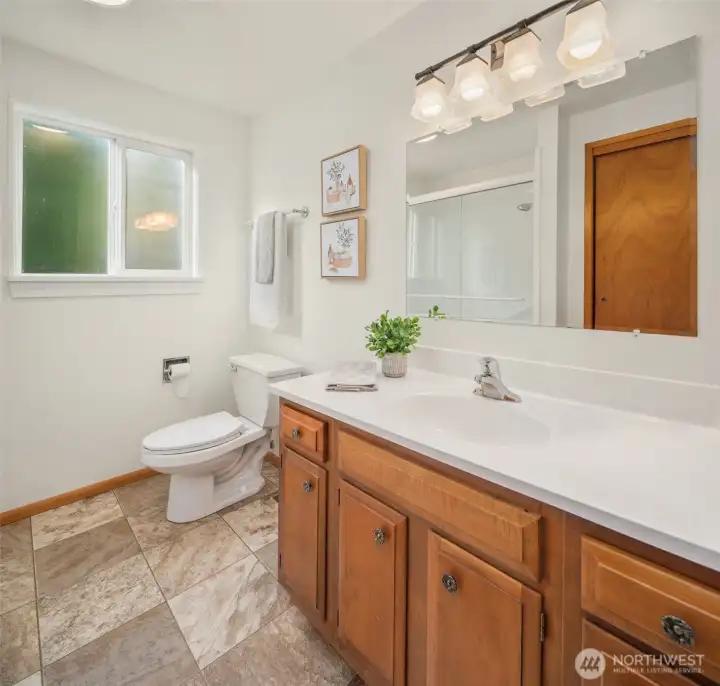 Hallway full bath serving bedrooms two and three.