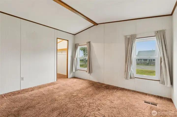 Primary bedroom with walk-in closet and attached full bath.