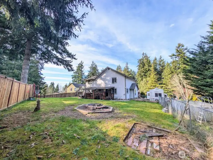 Back of home, RV &/or boat parking to the right, covered back deck, fire pit.  Great cul-de-sac location close to Bonney Lake & Lake Tapps amenities.