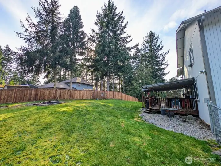 Another view of the huge back yard, deck & firepit.  RV/boat parking directly to the right.