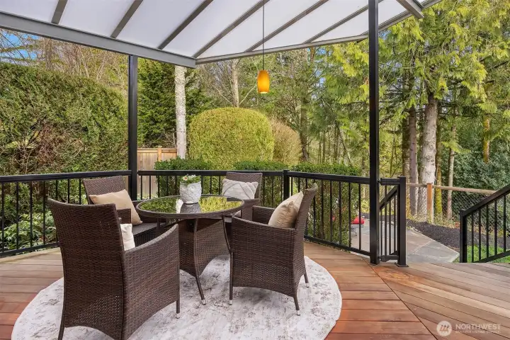 This inviting space opens to an expansive covered deck - ideal for indoor-outdoor living and year-round entertaining.