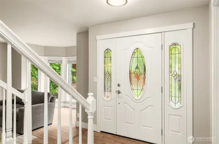 Rich Acacia hardwood flooring brings warmth and elegance to the entry.