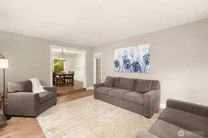 The spacious living room offers the perfect setting to gather or unwind.