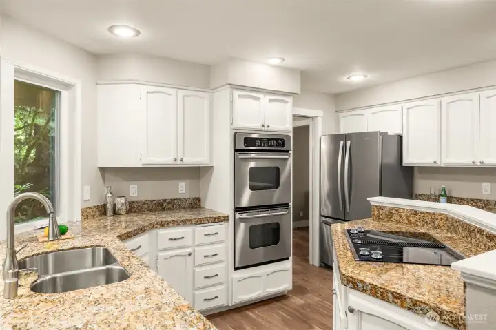 Crisp white cabinetry pairs perfectly with elegant quartz countertops.