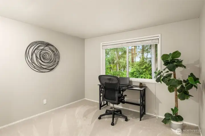 1 of 4 spacious upstairs bedrooms, currently serving as an office