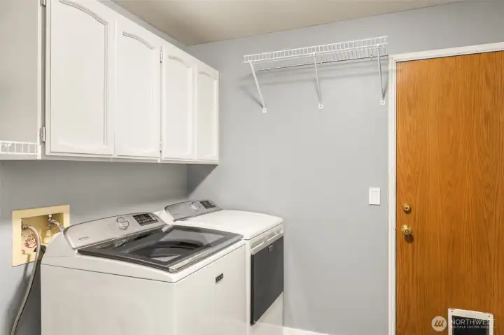 Laundry Room has LVP floors and a sink for dirty pets and shoes