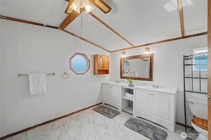 The ensuite bathroom has new flooring.