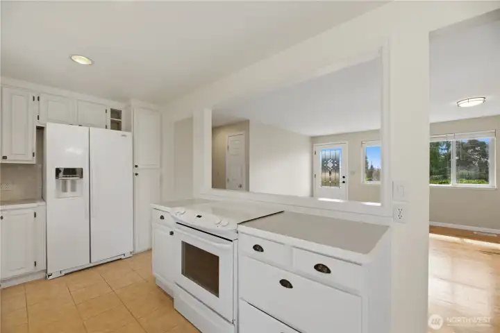 Light filled kitchen with ample storage and open flow…perfect for entertaining.