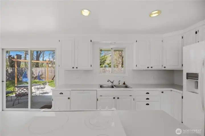 Easy access to Fully fenced backyard and patio.